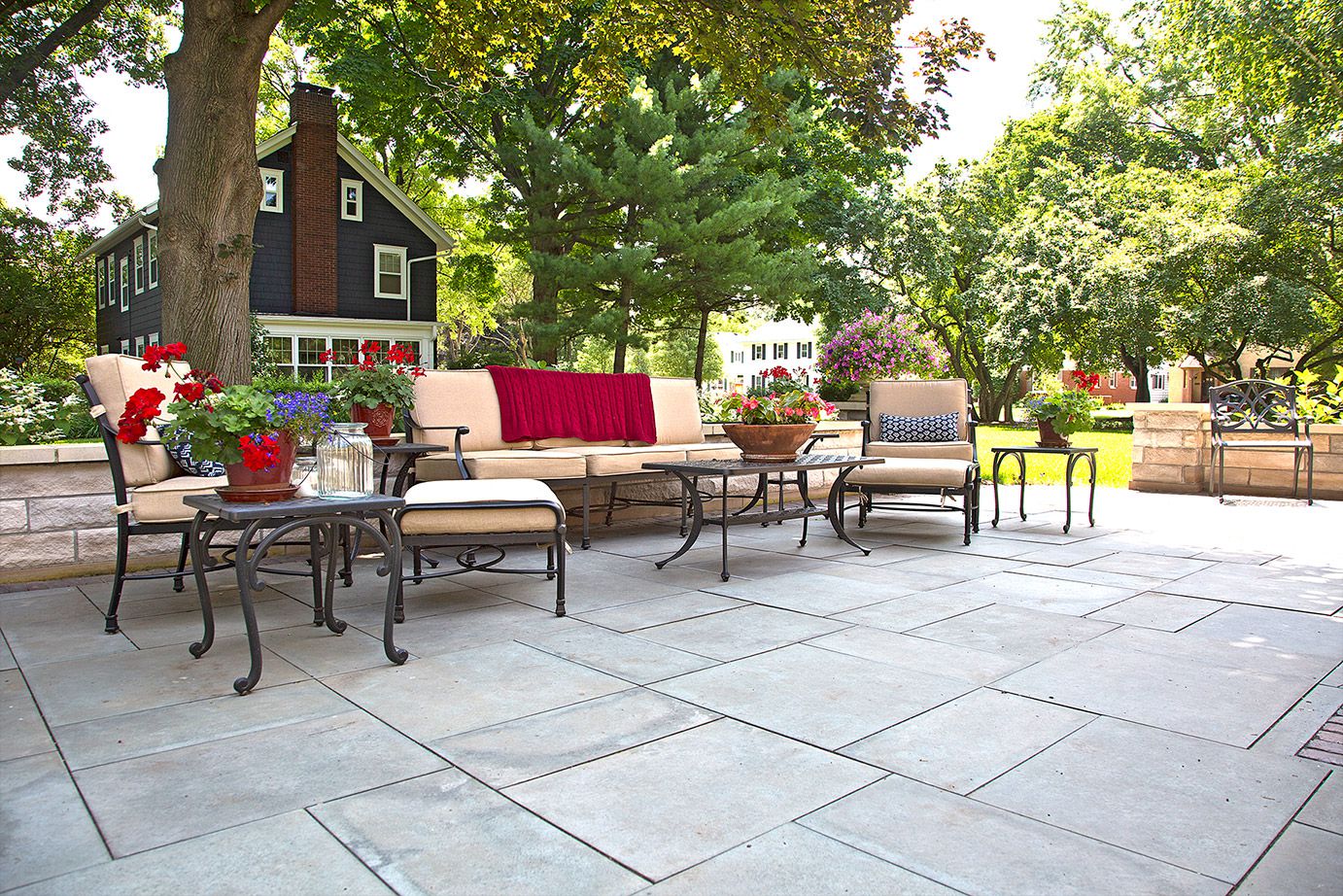 Beautiful stone patio and quality outdoor furniture by SereneScapes